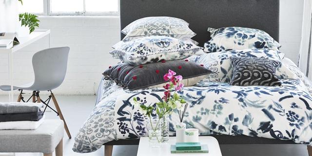 An assortment of furniture with some floral arragements